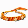 Bracelet bolo tressé jaune et orange breloque couleur dorée