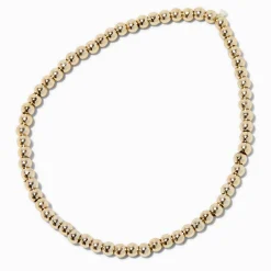 Bracelet élastique perlé couleur dorée Claire's Club