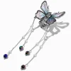 Pince à cheveux avec pendentif papillon couleur argentée